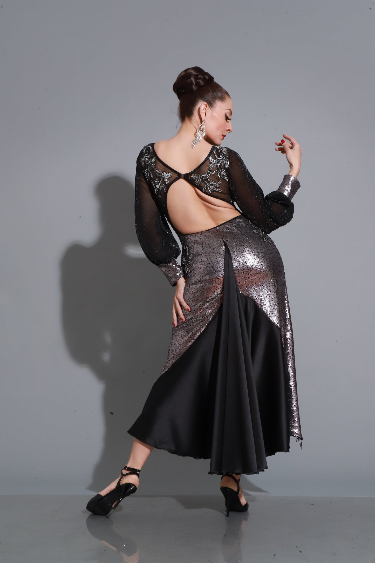 Black lace and satin with sheer accents and side slit — a timeless, sensual, and sophisticated design.