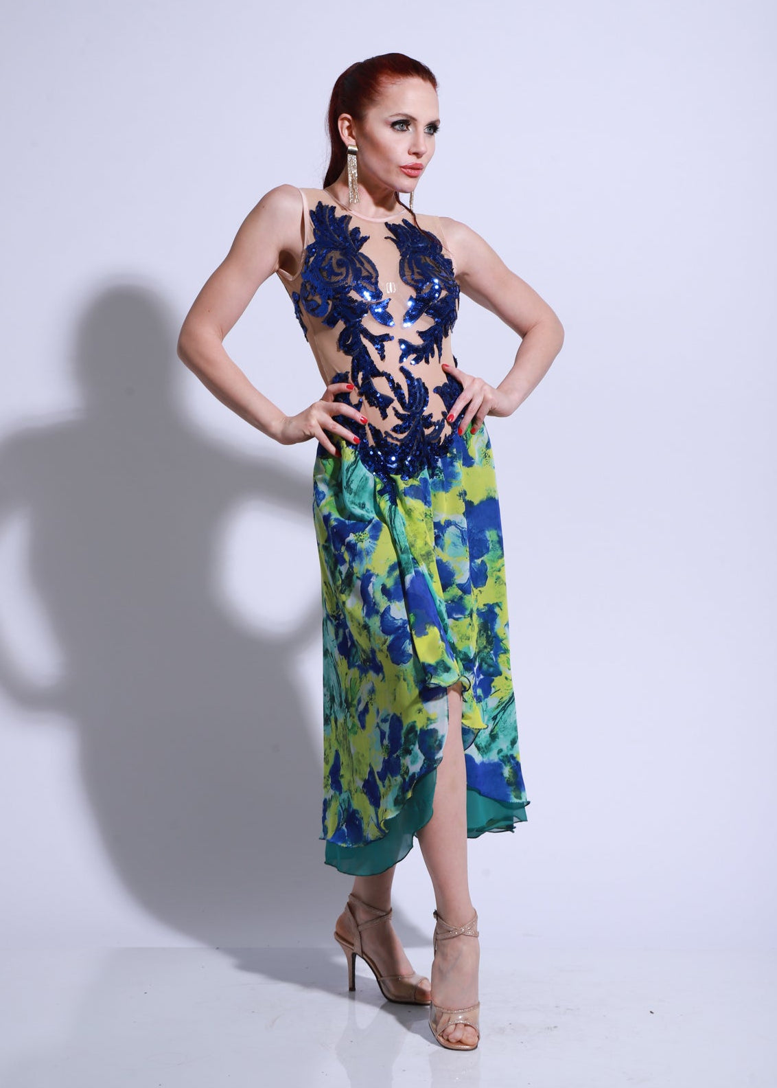 Stage tango dress with navy lace bodice and multicolor floral skirt, featuring a slit and soft draped fall.