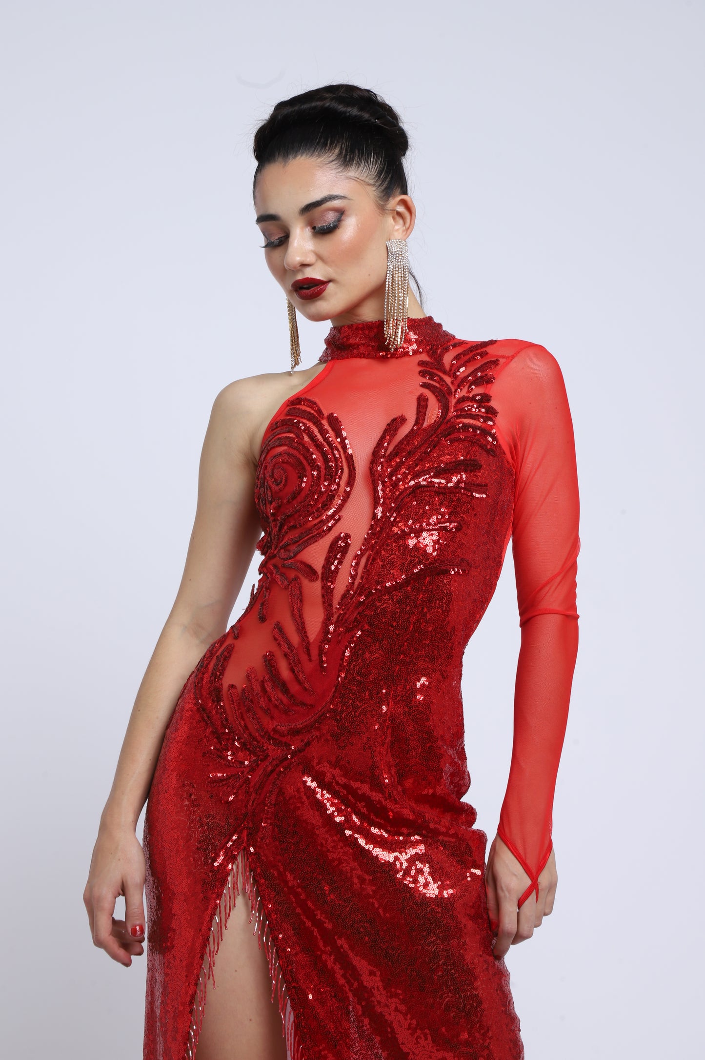 Striking asymmetrical design with one sleeve, halter neckline, and front slit.
Hand-embroidered with sequins on stretch mesh and lycra.
Its passionate red color and sheer details make it perfect for stage or show.
Limited edition. Handmade in Argentina.
